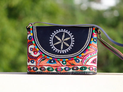 Leather bag adorned with authentic Kutchi hand embroidery on premium leather