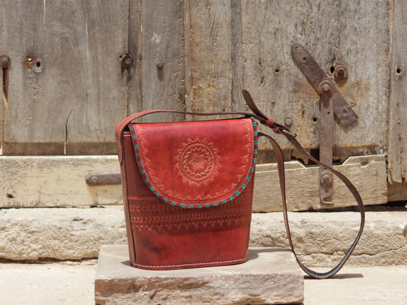 Handcrafted leather bag showcasing decorative thread work and heritage craftsmanship
