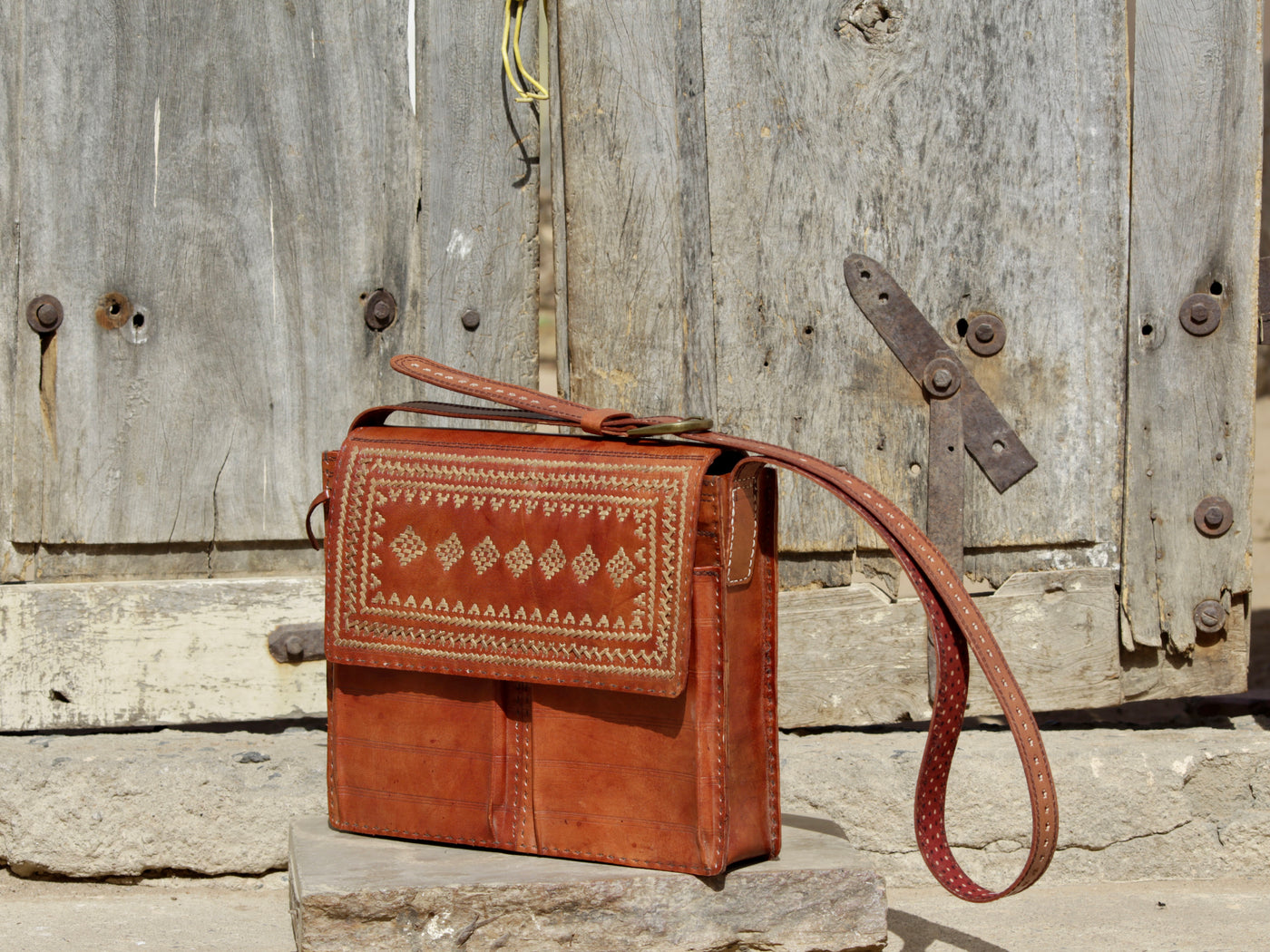Leather office bag featuring intricate thread work on premium handcrafted leather