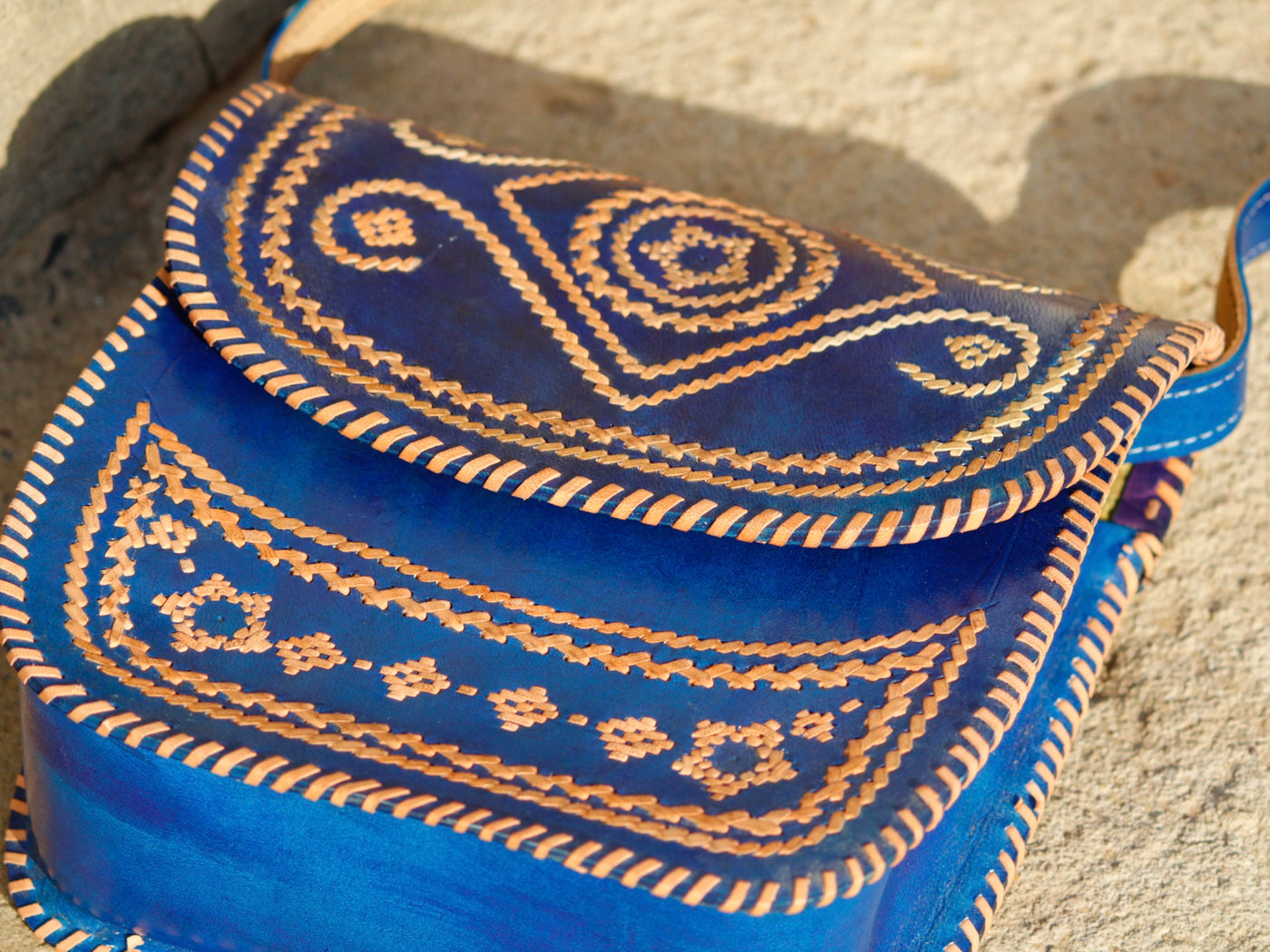 Elegant leather bag with embroidered accents and durable leather construction