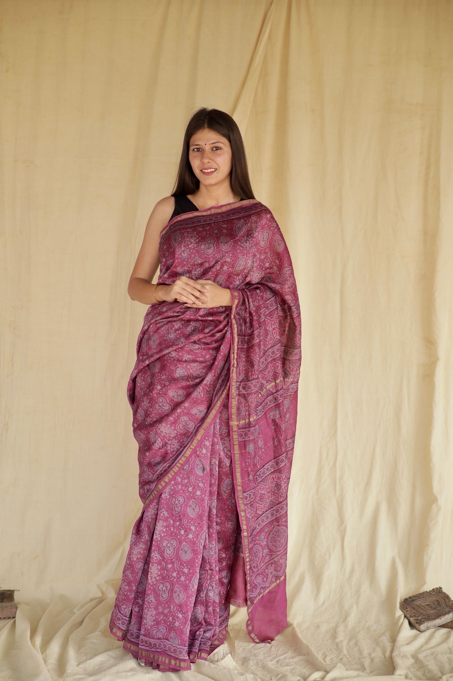 Light magenta Ajrakh Chanderi silk saree featuring intricate hand block printed motifs and an elegant drape
