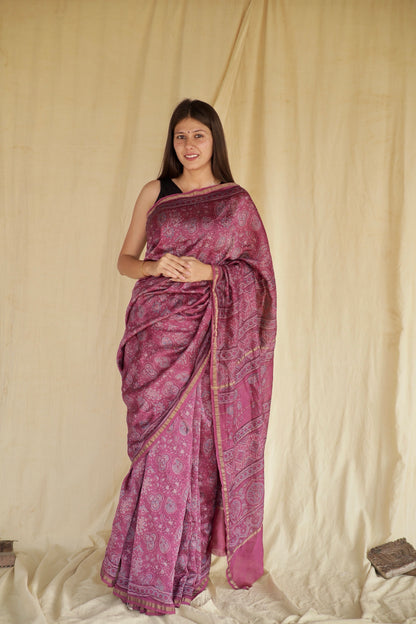 Light magenta Ajrakh Chanderi silk saree featuring intricate hand block printed motifs and an elegant drape