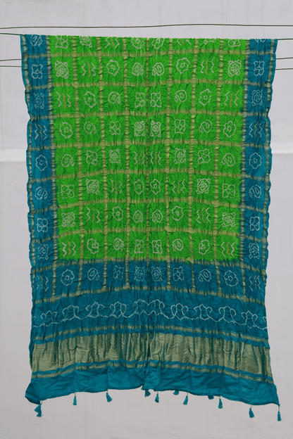 Lime green Bandhani Gharchola dupatta featuring traditional tie-dye craftsmanship and classic Gharchola patterns