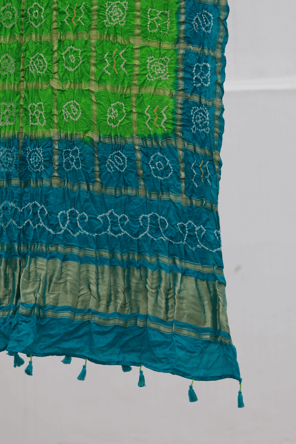 Handcrafted lime green Gharchola dupatta adorned with authentic Bandhani artistry