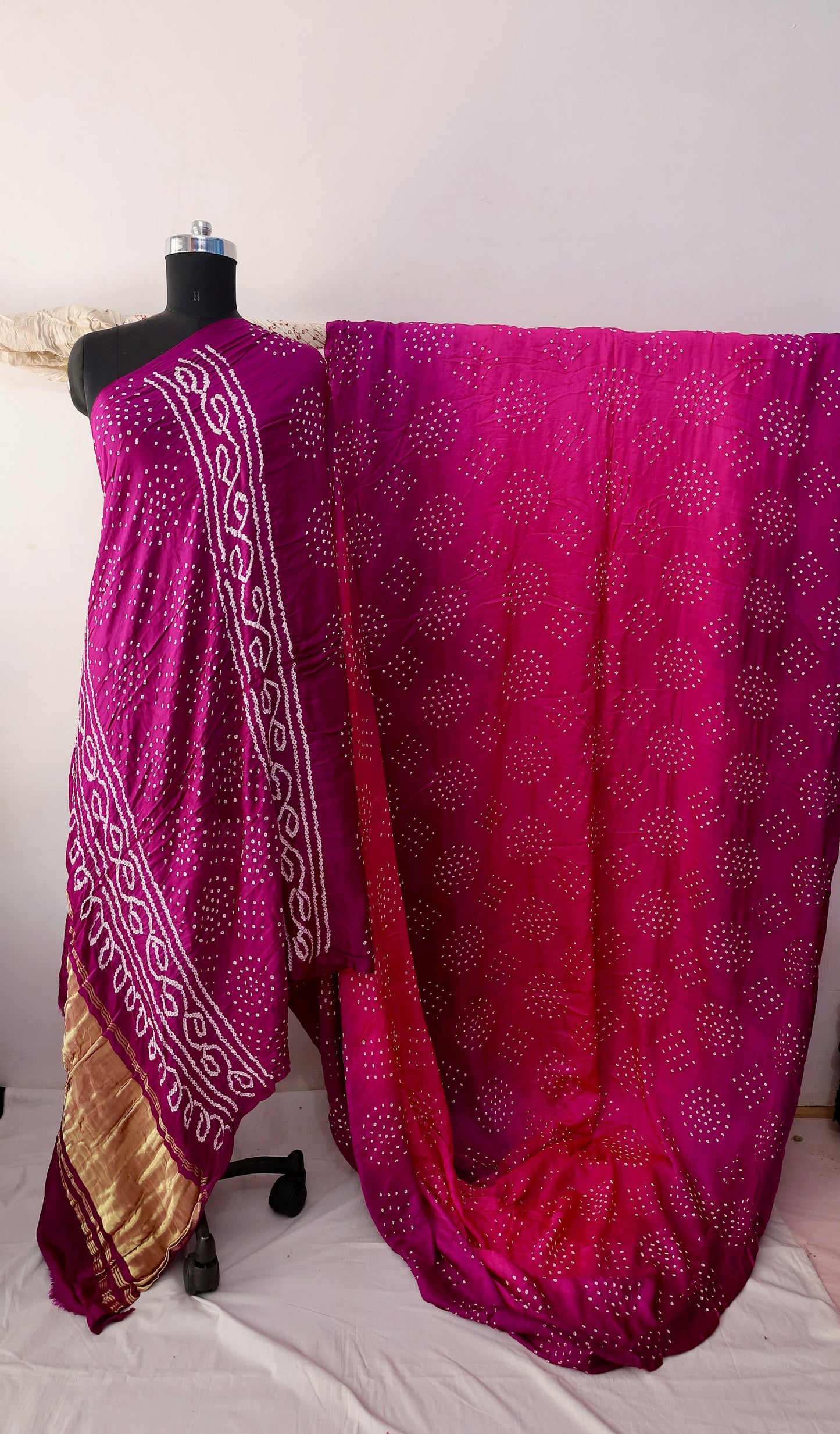 Magenta Bandhani Gajji silk saree featuring intricate tie-dye patterns and an elegant zari pallu
