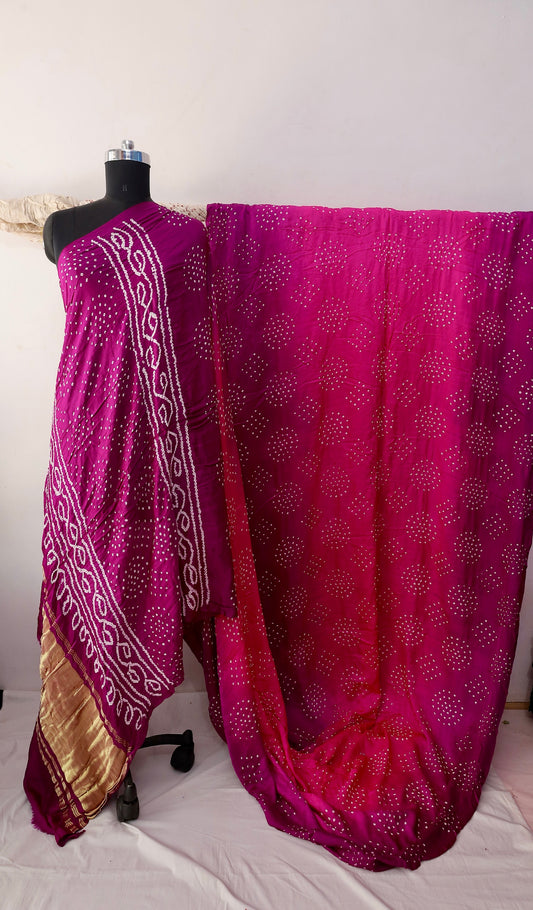 Magenta Bandhani Gajji silk saree featuring intricate tie-dye patterns and an elegant zari pallu