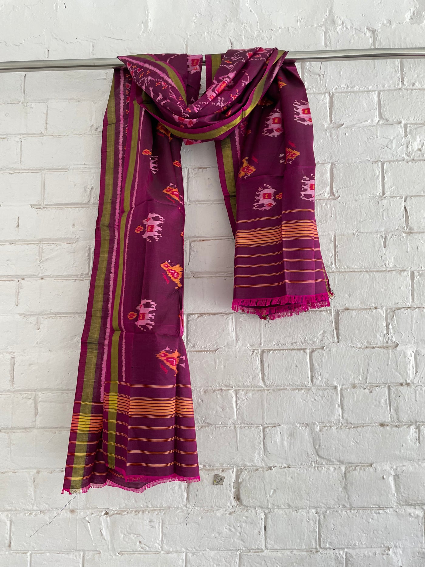 Magenta Patola Single Ikkat dupatta featuring intricate woven motifs and traditional artisan craftsmanship