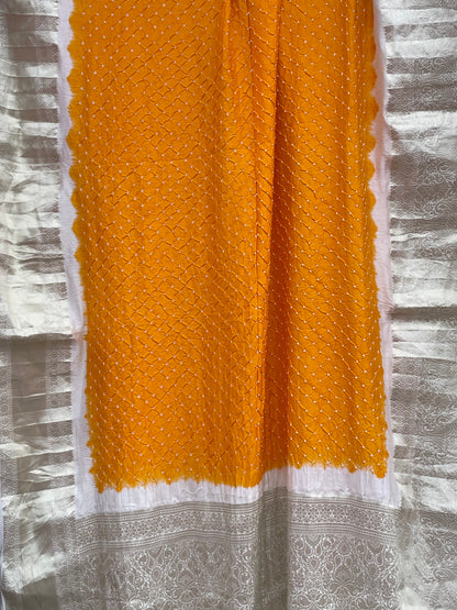Ethnic marigold yellow silk dupatta showcasing authentic Bandhani artistry and elegant drape