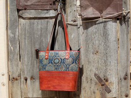 Mashru silk leather bag crafted with premium leather and traditional woven silk detailing