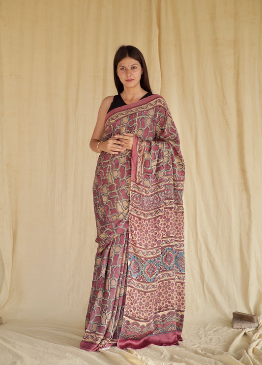 Mauve pink Ajrakh modal silk saree featuring intricate hand block printed motifs and a graceful drape