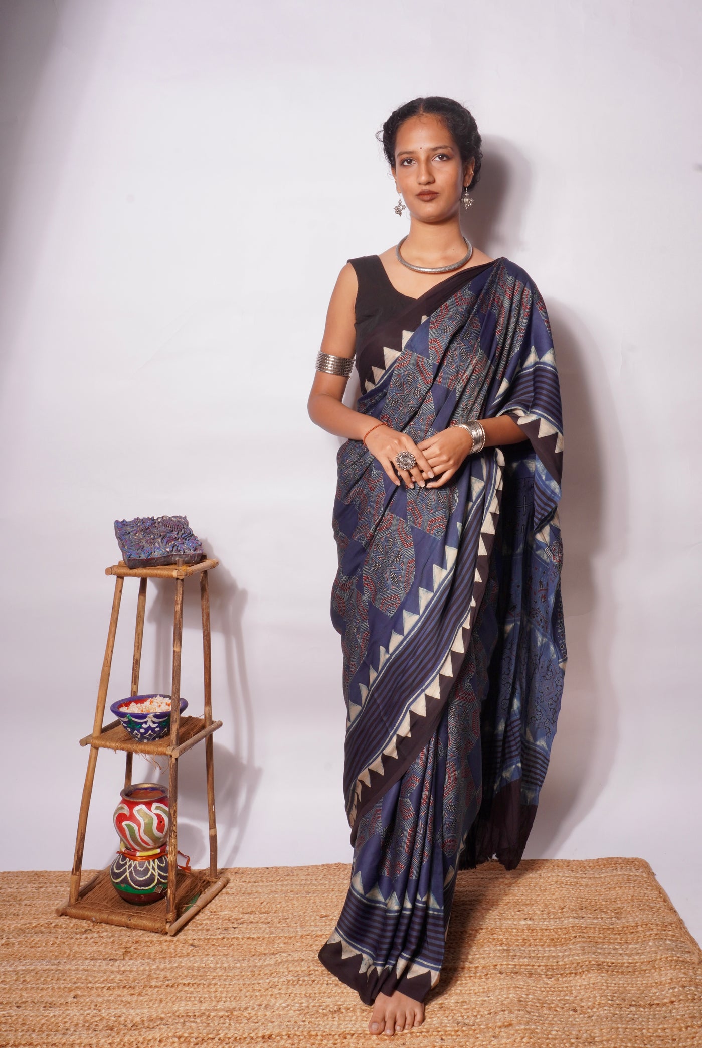 Midnight navy Ajrakh modal silk saree featuring intricate hand block printed motifs and a graceful drape