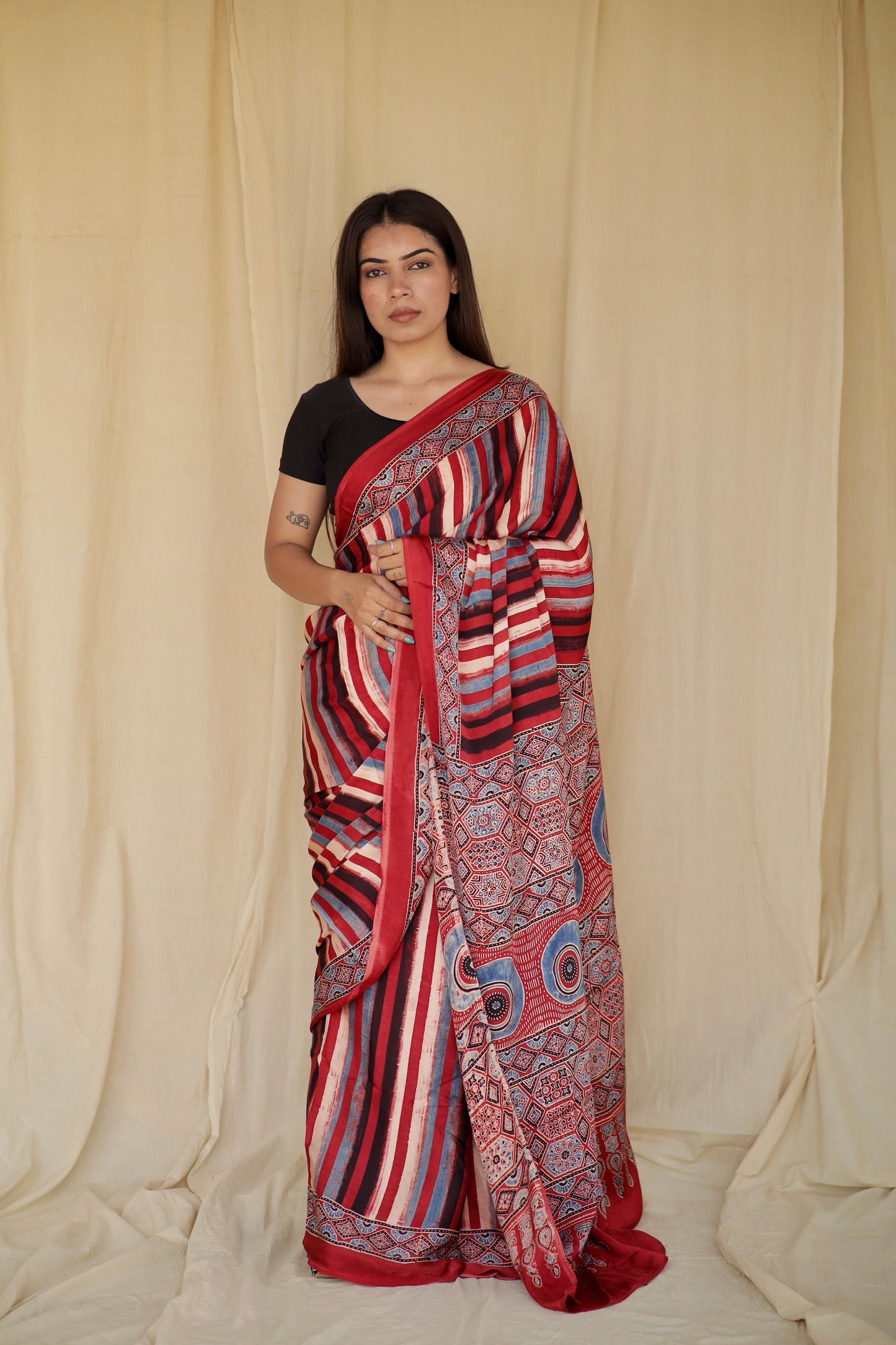Multicolor stripe Ajrakh modal silk saree featuring intricate hand block printed motifs and a graceful drape
