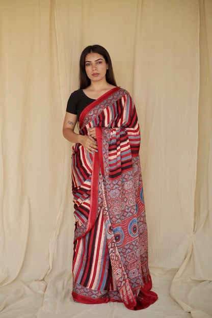Multicolor stripe Ajrakh modal silk saree featuring intricate hand block printed motifs and a graceful drape
