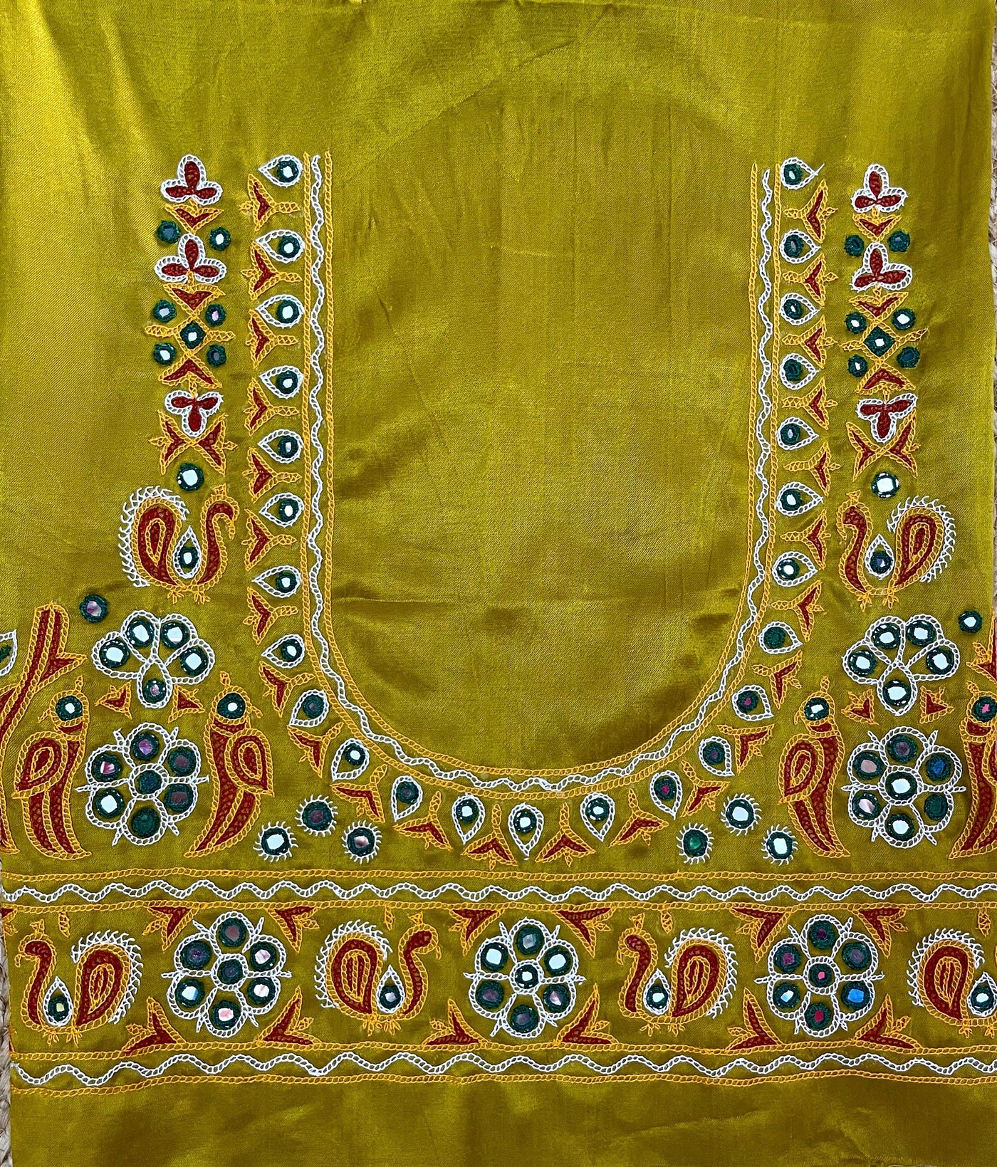 Mustard yellow Ahir embroidery blouse piece showcasing intricate handcrafted embroidery details