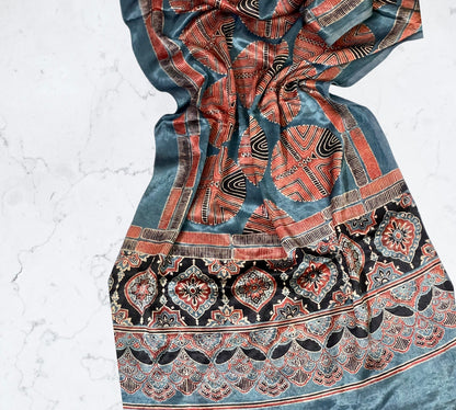 Ocean blue Ajrakh Mashru silk stole featuring intricate hand block printed motifs and elegant drape