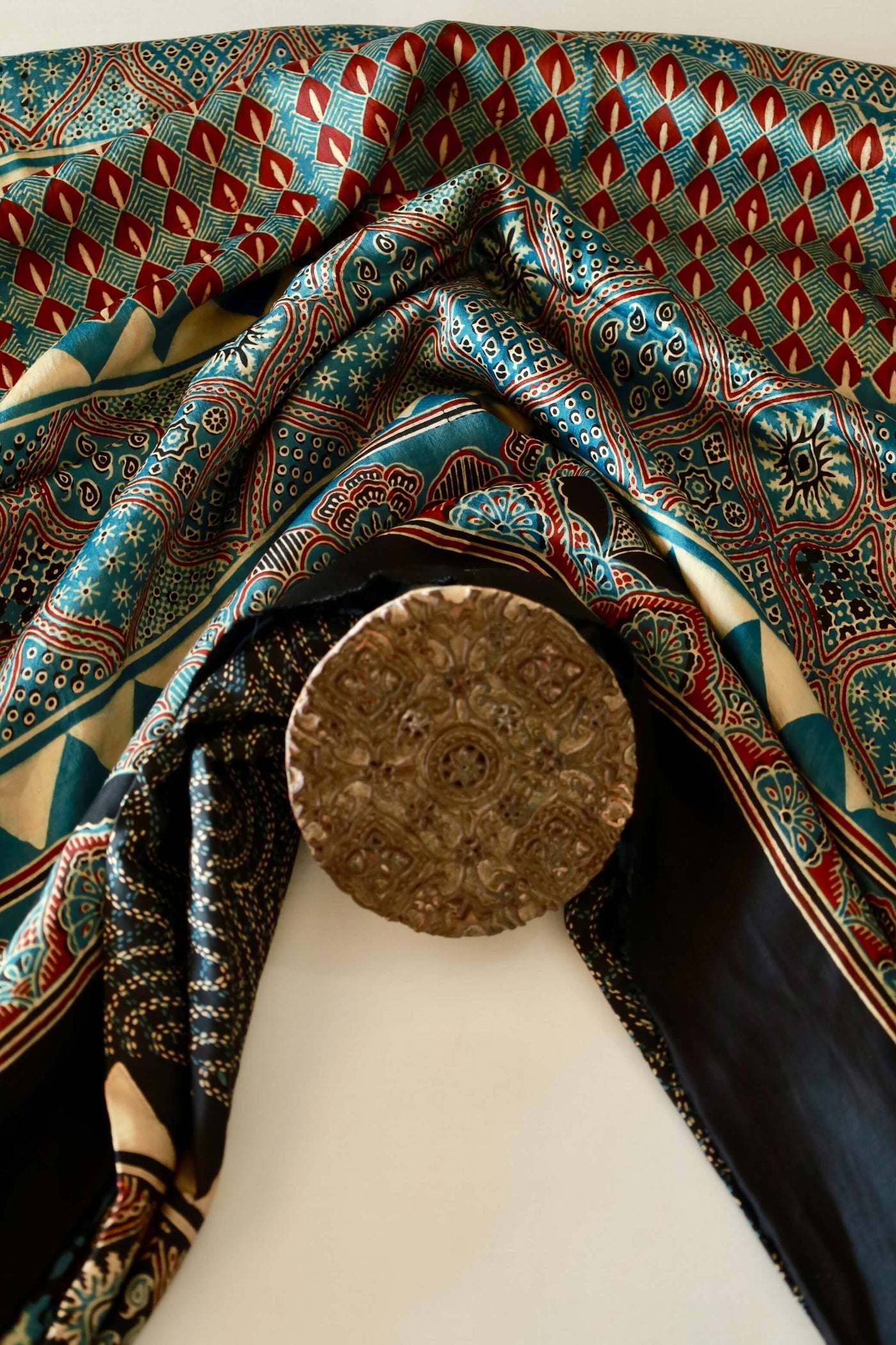 Ocean blue Ajrakh modal silk saree featuring intricate hand block printed motifs and a graceful drape