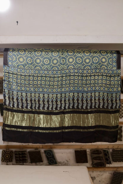 Olive blue Ajrakh modal silk dupatta with Lagdi Patta featuring intricate block printed motifs and elegant drape