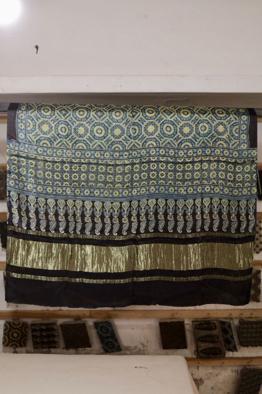 Olive blue Ajrakh modal silk dupatta with Lagdi Patta featuring intricate block printed motifs and elegant drape