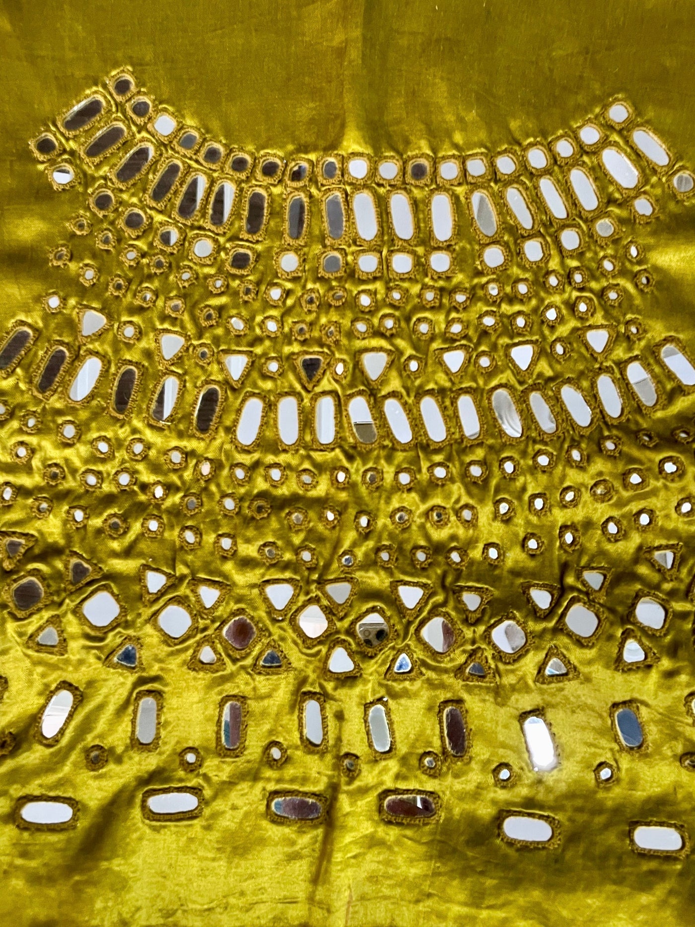 Olive gold mirror work blouse piece showcasing intricate handcrafted embellishments