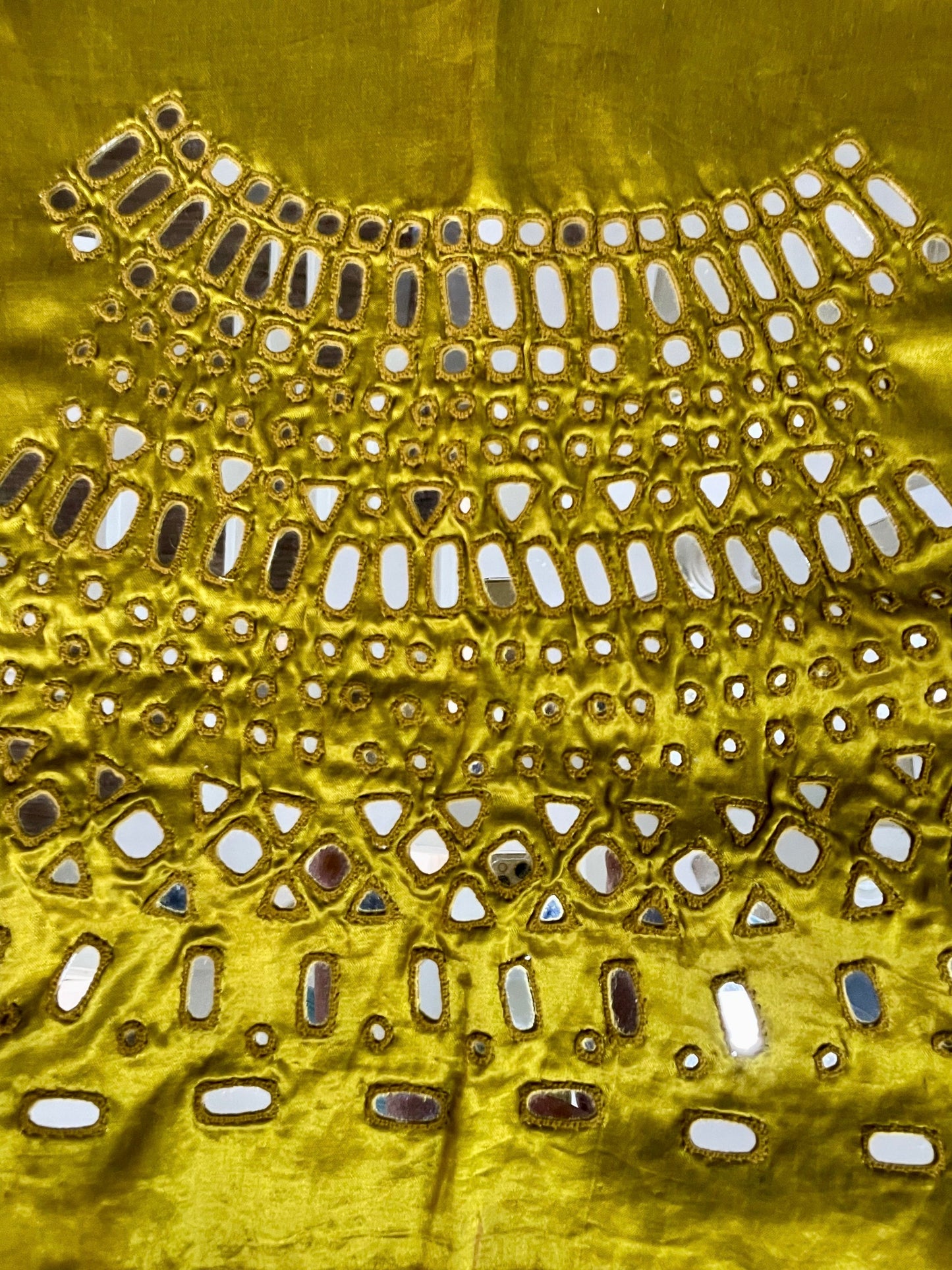 Olive gold mirror work blouse piece showcasing intricate handcrafted embellishments