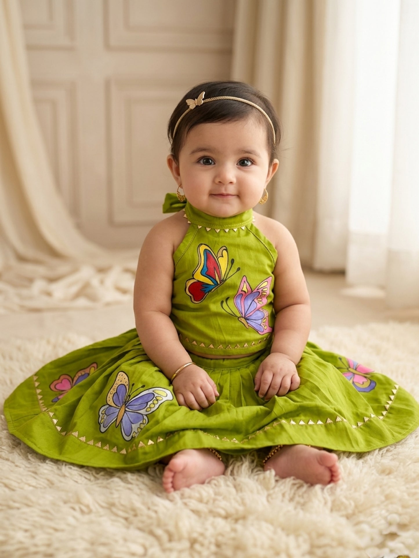 Parrot green handpainted cotton lehenga choli set for kids featuring handcrafted artwork and traditional elegance