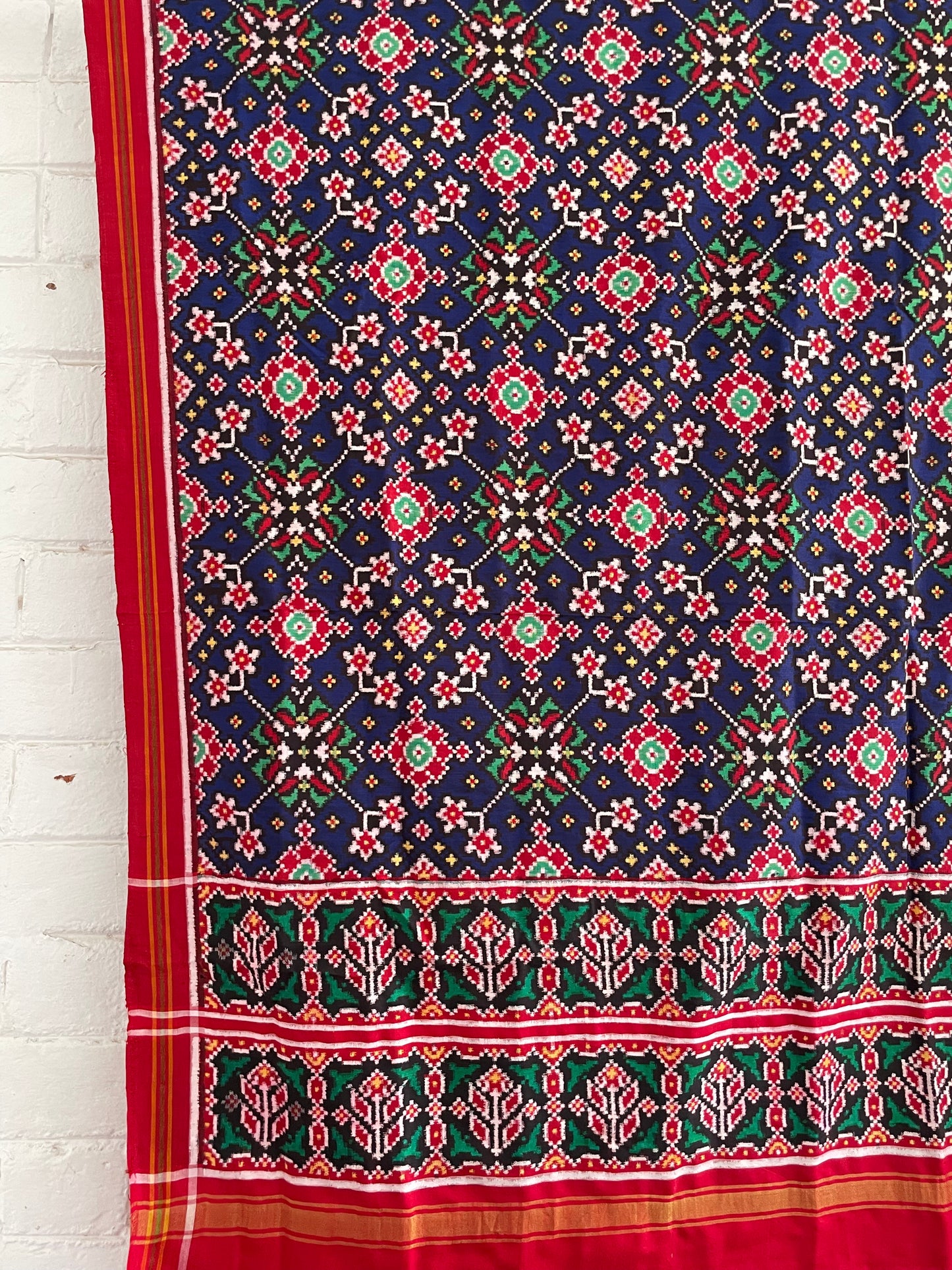 Patola Double Ikat silk dupatta featuring intricate geometric patterns and traditional handwoven craftsmanship