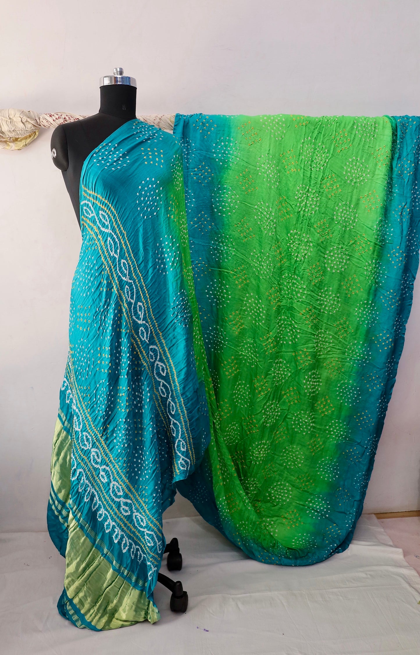Peacock Bandhani Gajji silk saree featuring intricate tie-dye patterns and an elegant zari pallu