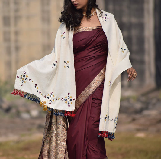 Pearl white handwoven woolen stole featuring a soft texture and timeless artisanal craftsmanship