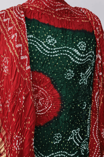 Luxurious pine green and red Bandhani dupatta crafted in soft and lustrous Gajji silk