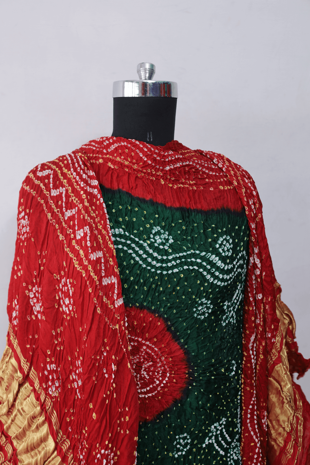 Ethnic pine green and red Gajji silk dupatta showcasing authentic Bandhani artistry