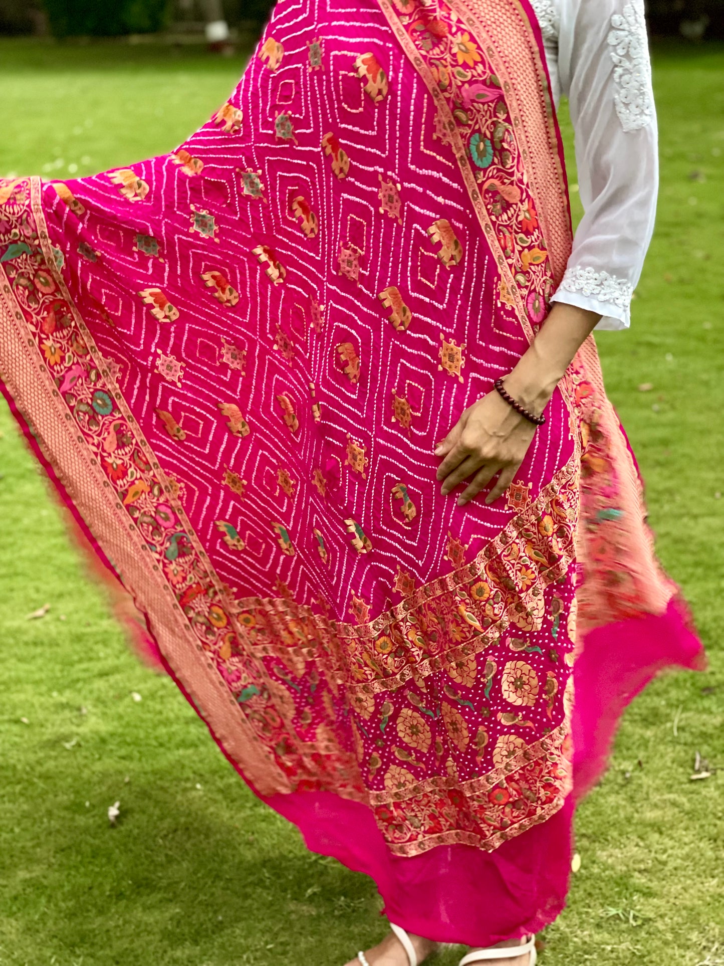 Traditional pink Bandhani georgette dupatta with intricate artisanal patterns