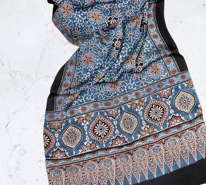 Powder blue Ajrakh modal silk stole featuring intricate hand block printed motifs and elegant drape