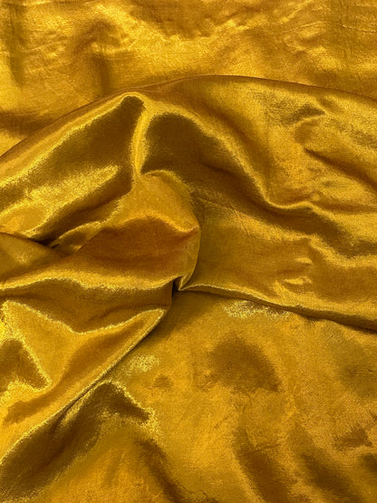 Premium antique gold ethnic dress material adorned with decorative mirror accents