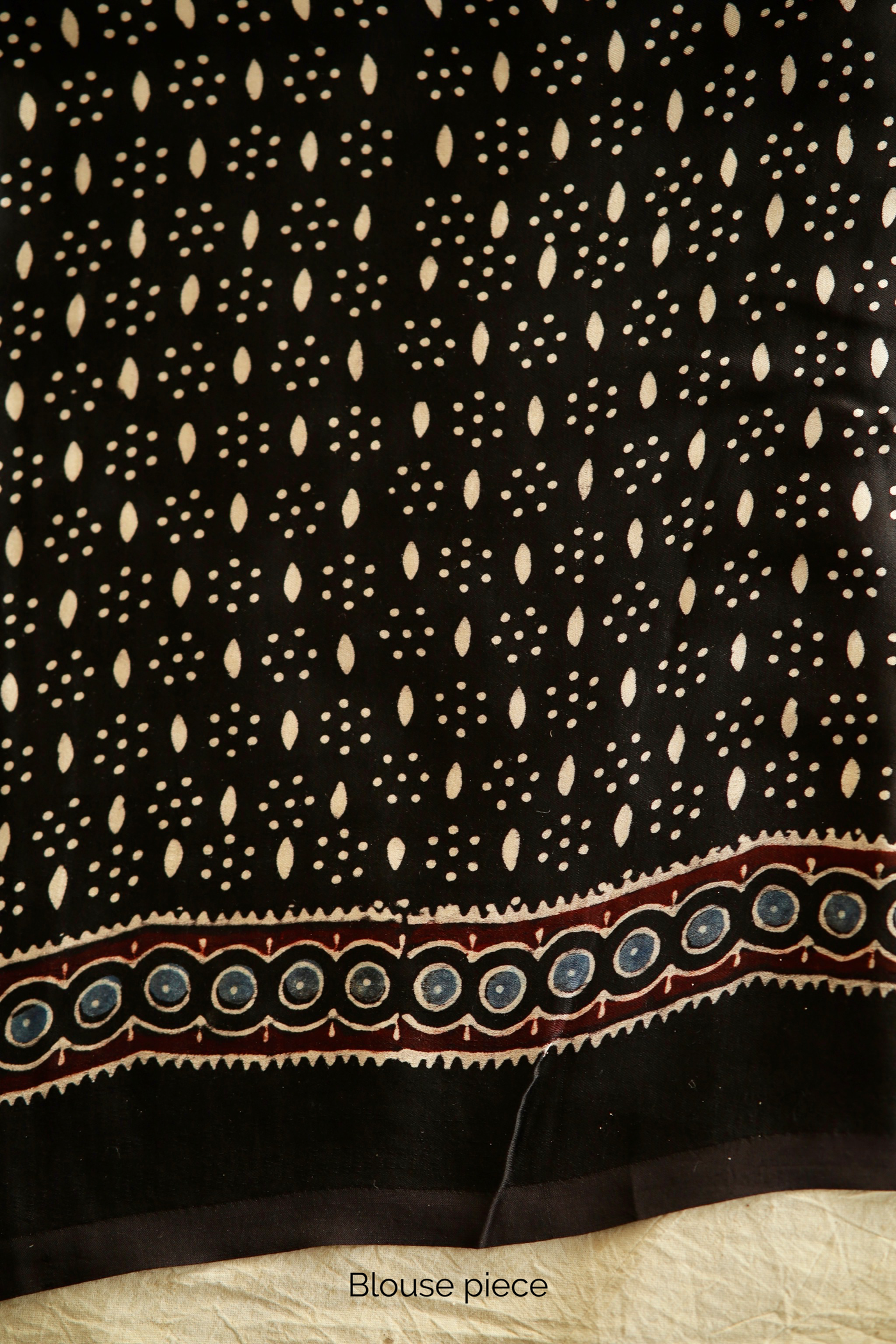 Traditional Black Lotus Ajrakh printed modal silk saree crafted by artisans with fluid texture and timeless appeal