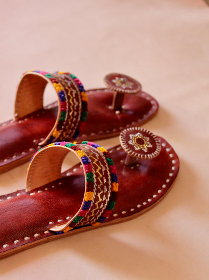 Brown handstitched leather flats showcasing traditional craftsmanship and comfortable design