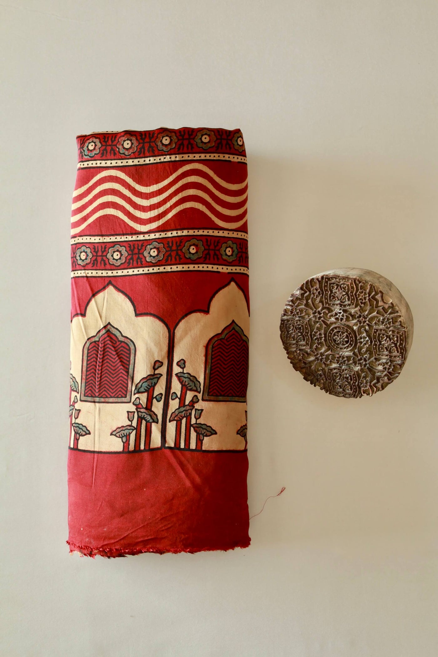 Premium burgundy modal silk saree showcasing authentic Ajrakh craftsmanship and timeless motifs