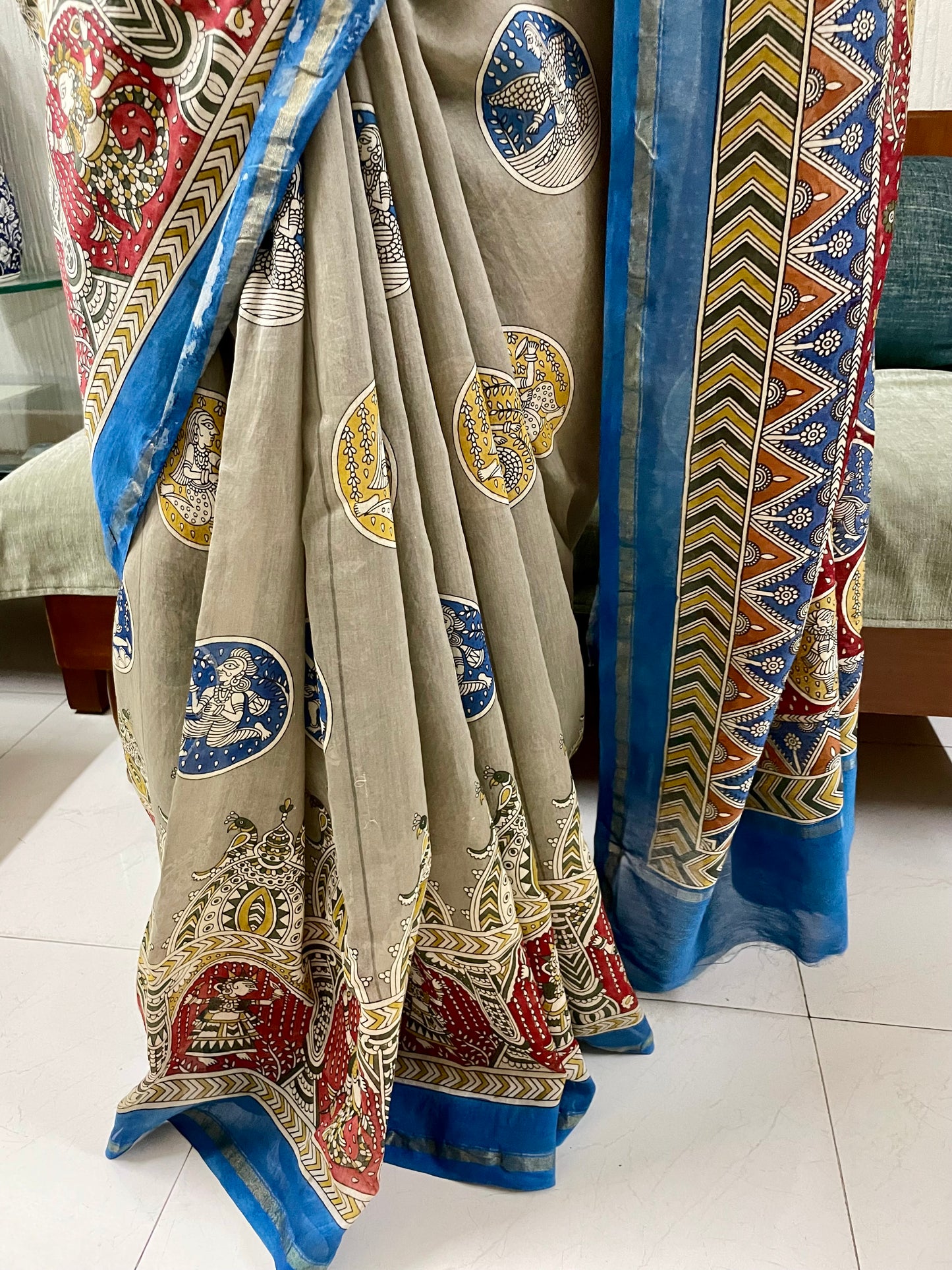 Premium creamy red handpainted saree reflecting the cultural richness and storytelling tradition of Mata Ni Pachedi art