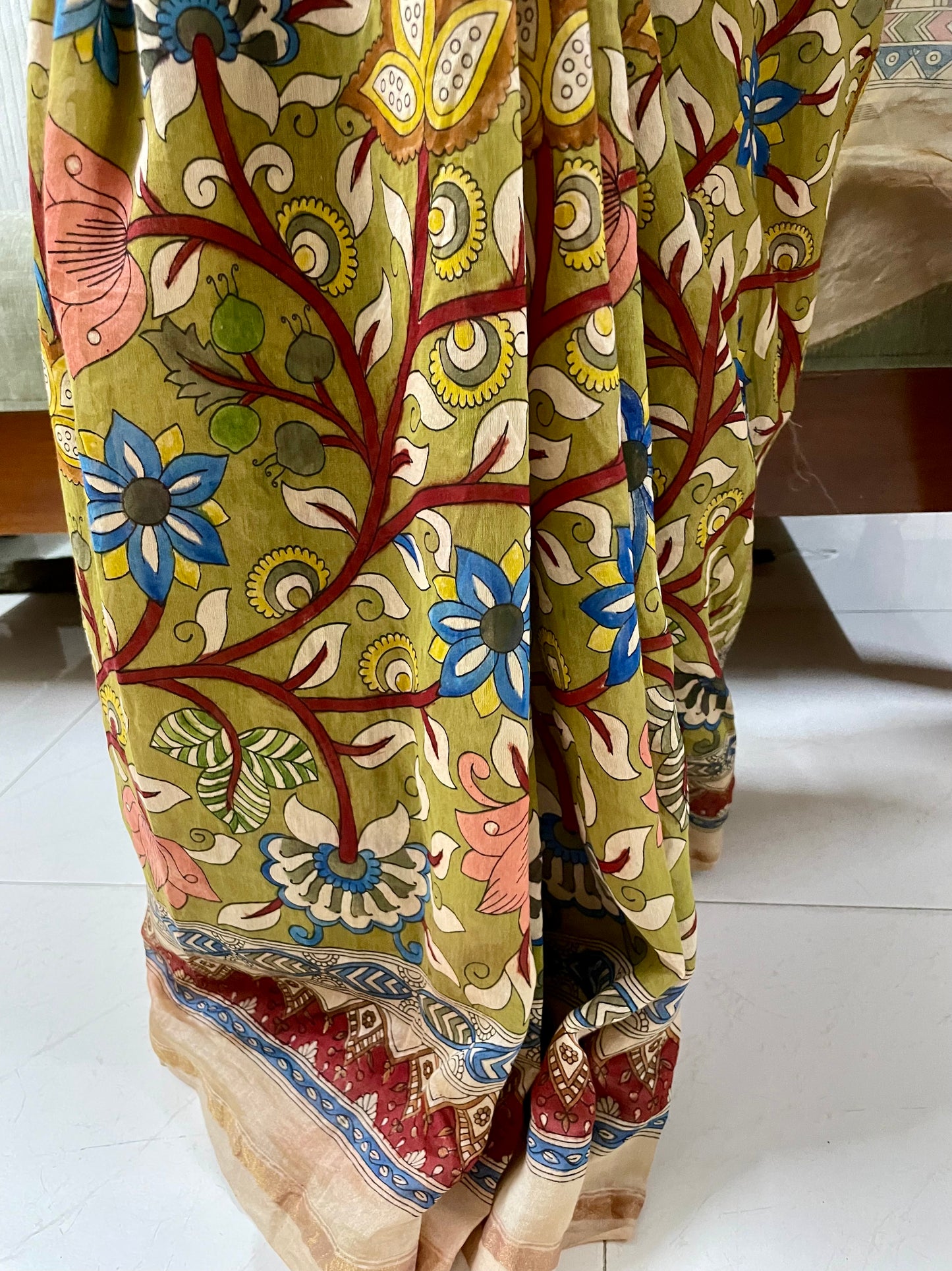 Premium crimson handpainted saree reflecting the cultural richness and storytelling tradition of Mata Ni Pachedi art