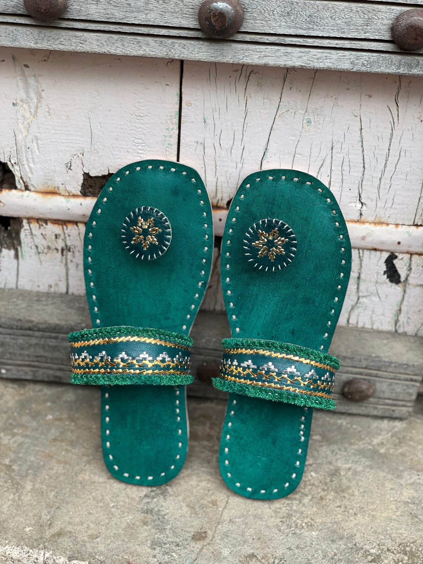 Premium cyan handcrafted leather flats with fine artisan stitching details