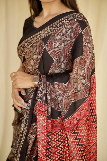 Traditional dark mocha Ajrakh printed modal silk saree crafted by artisans with exceptional craftsmanship