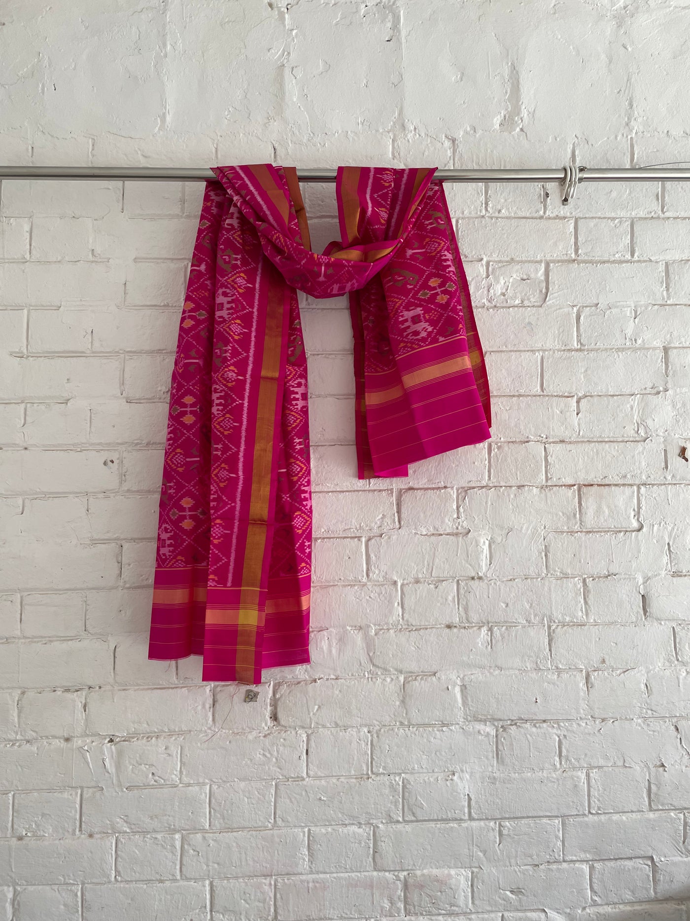 Dark pink Patola Single Ikkat dupatta featuring intricate woven motifs and traditional artisan craftsmanship