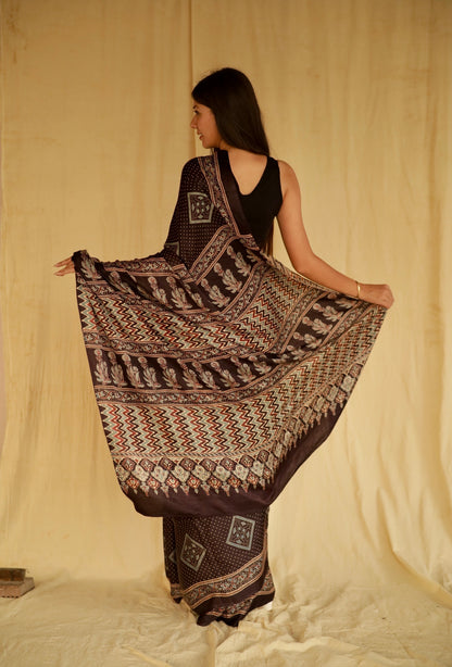 Premium deep black modal silk saree showcasing authentic Ajrakh craftsmanship and heritage-inspired motifs