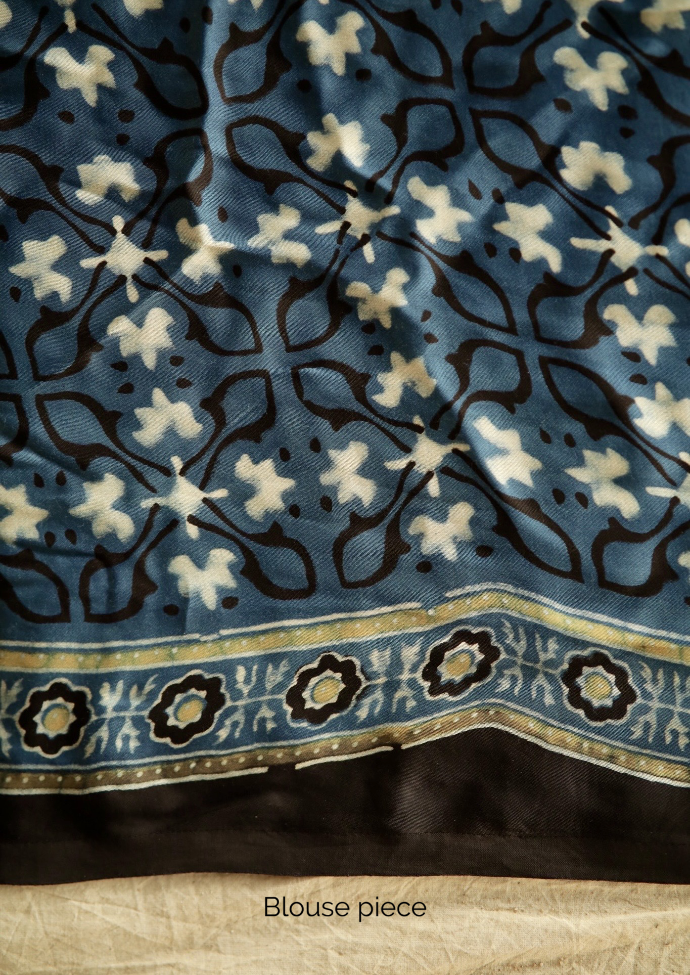 Traditional denim blue Ajrakh printed modal silk saree crafted by artisans with exceptional craftsmanship