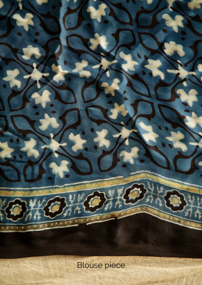 Traditional denim blue Ajrakh printed modal silk saree crafted by artisans with exceptional craftsmanship