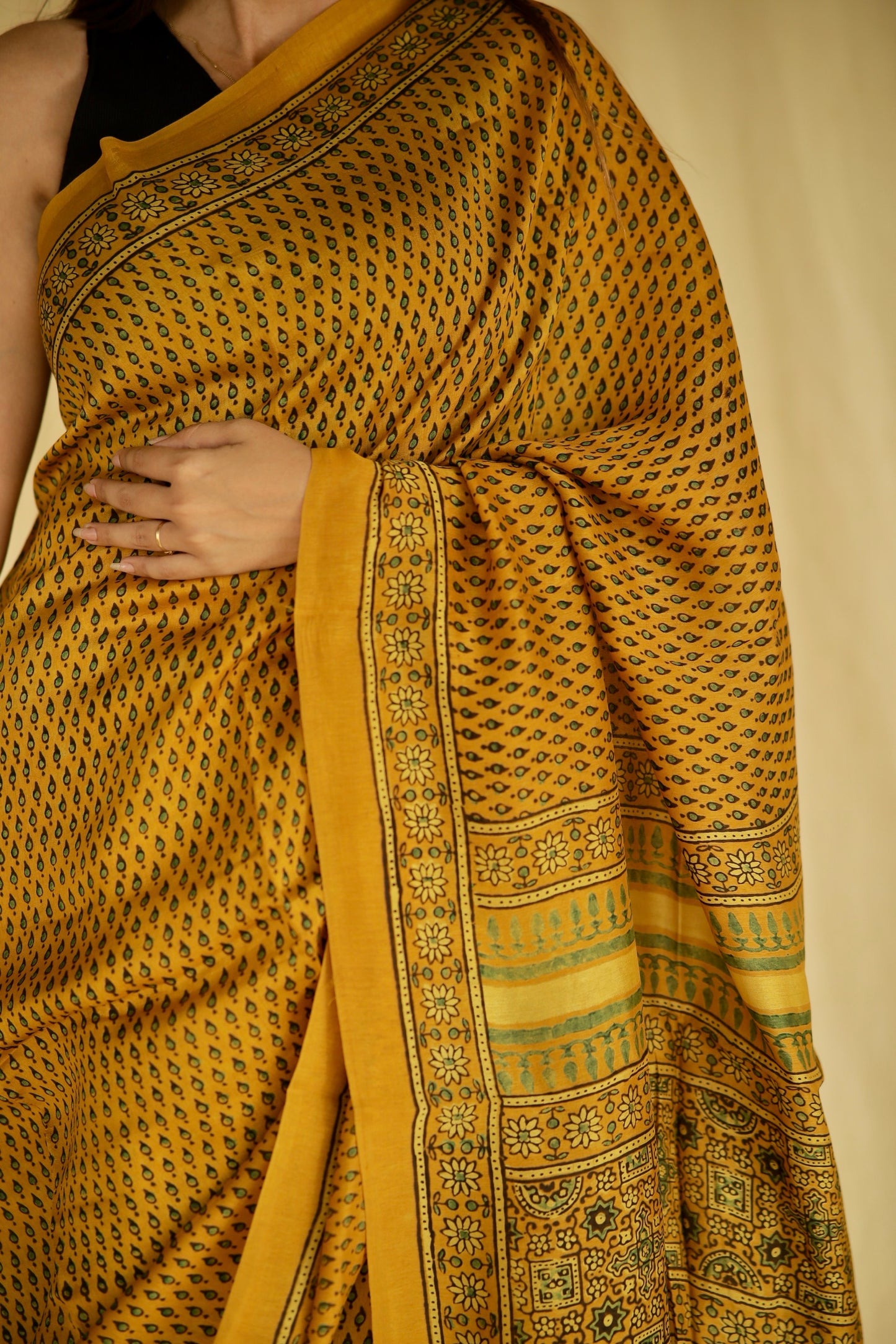 Traditional golden mustard Ajrakh printed Chanderi silk saree crafted by artisans with refined craftsmanship