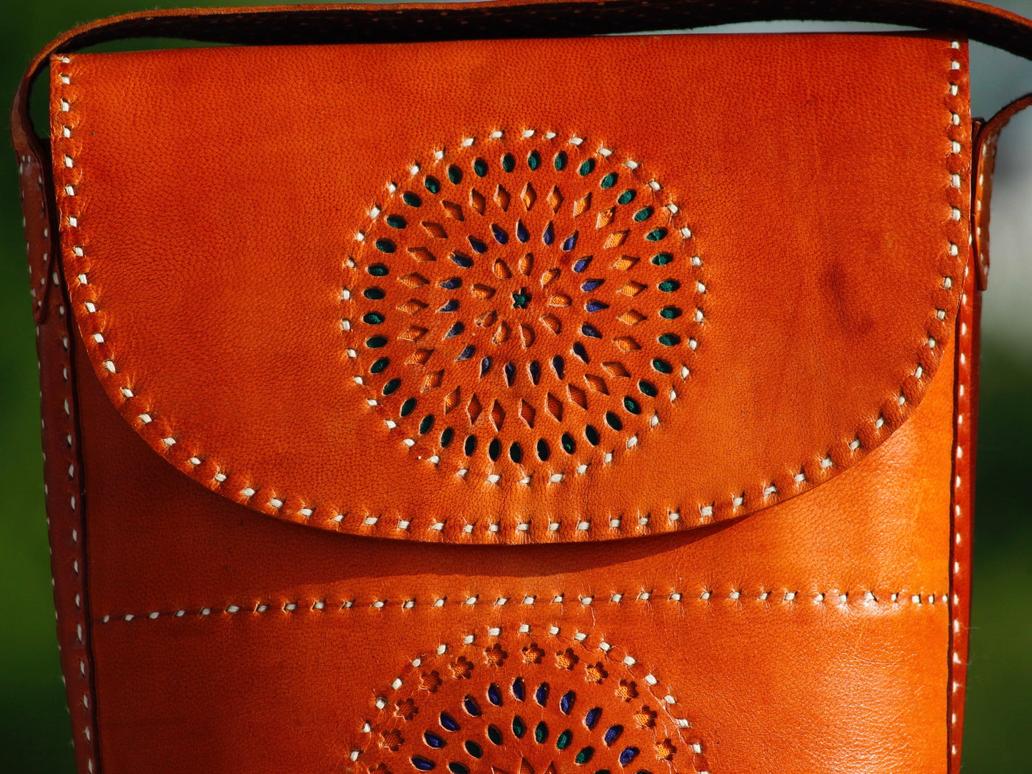 Artisan-made leather bag featuring durable construction and traditional hand stitching