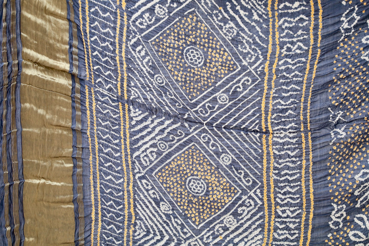 Handcrafted indigo silk saree showcasing authentic Rai Bandhani artistry with rich zari detailing