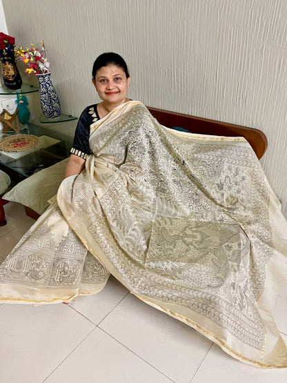 Premium ivory white handpainted saree reflecting the cultural richness and storytelling tradition of Mata Ni Pachedi art