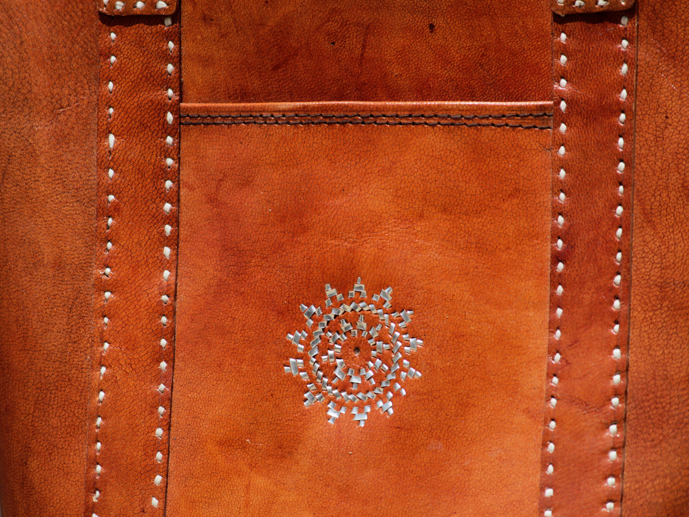 Premium leather bag combining durable leather craftsmanship with luxurious zari detailings