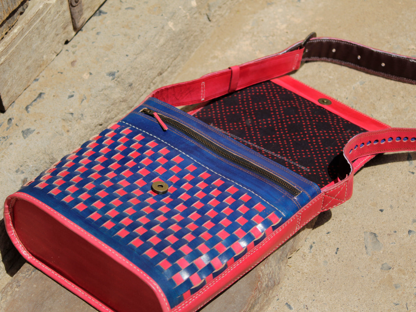 Leather bag adorned with intricate zari work on premium handcrafted leather